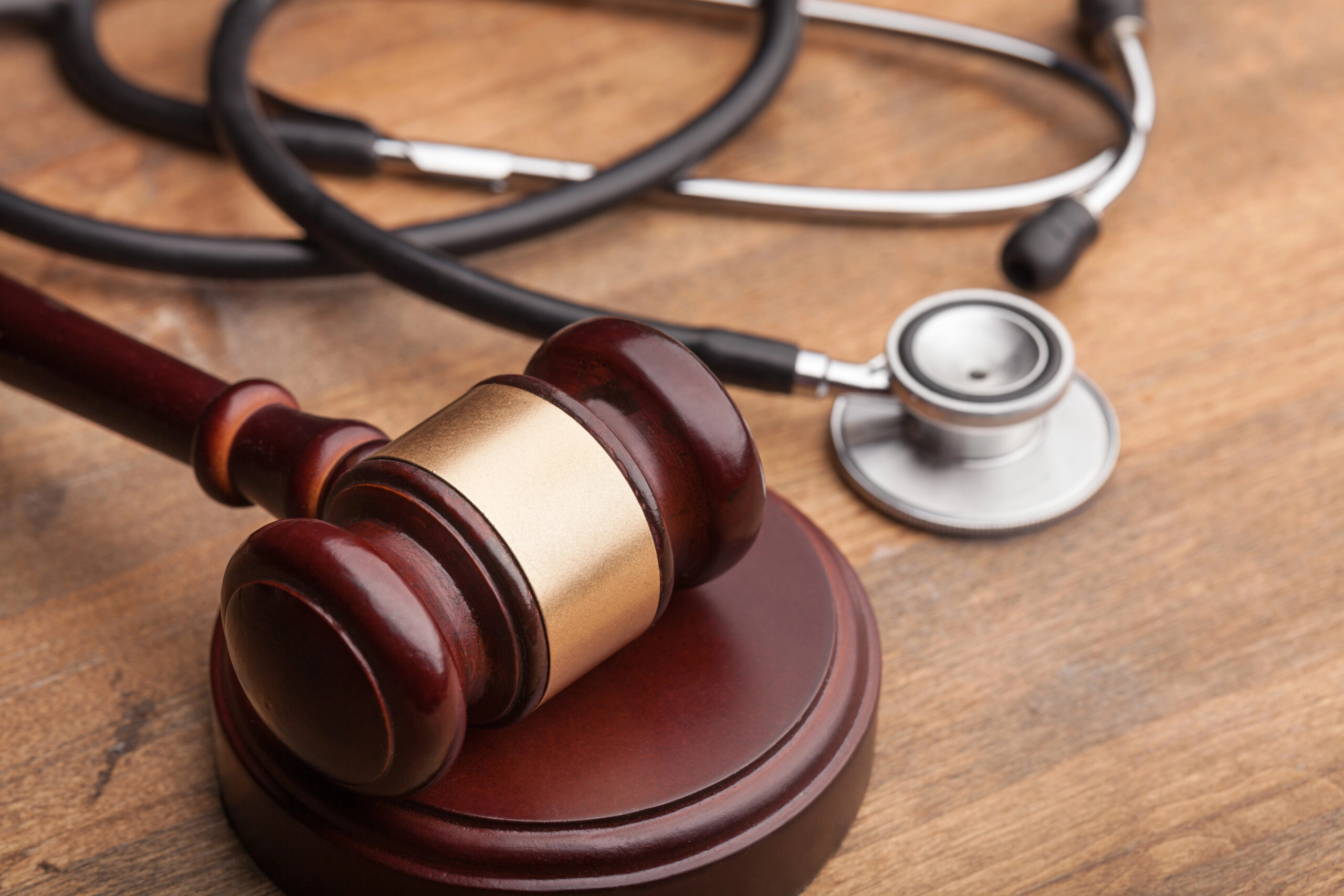 Gavel and stethoscope representing legal cases of medical negligence