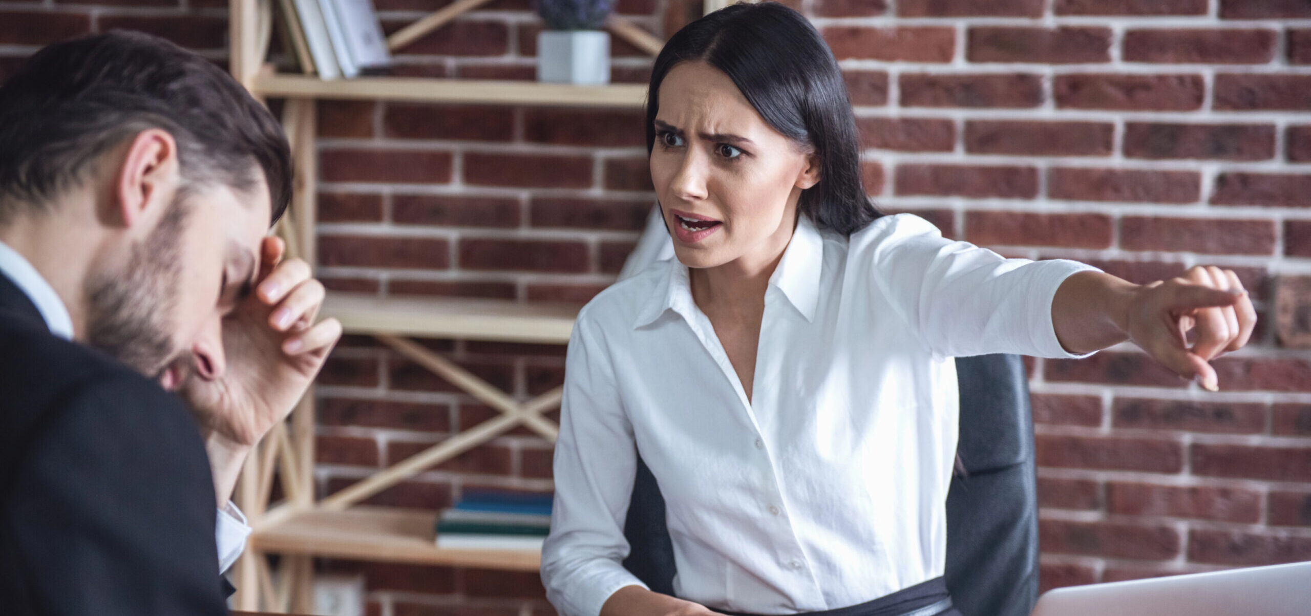 Angry manager dismissing worker over payroll dispute and unpaid wages in the UK