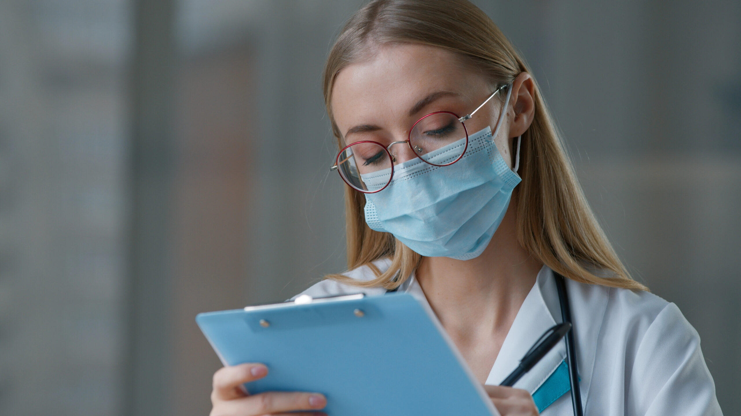 Doctor reviewing records for potential misdiagnosis medical