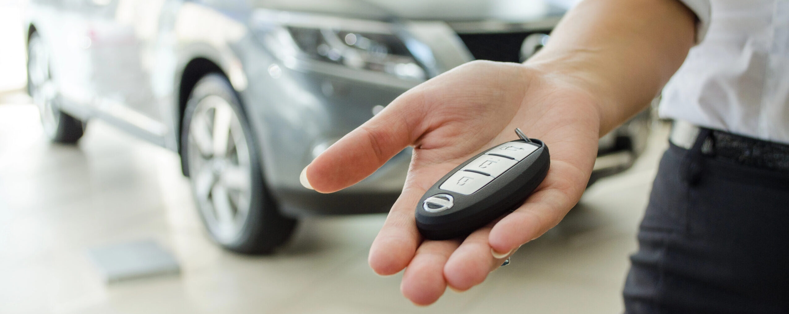 A concerned man reviews car finance documents, highlighting delayed contract information risks.